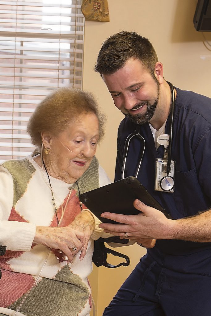 Nurse assists elderly resident