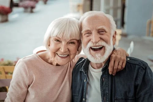 A happy couple smiles