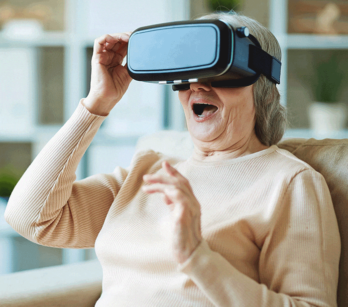 A woman reacts while wearing virtual reality goggles